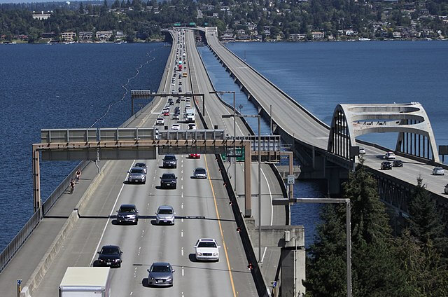 The Interstate 90 floating bridges over Lake Washington, viewed from the Seattle side / Wikipedia / SounderBruce
Link: https://en.wikipedia.org/wiki/Homer_M._Hadley_Memorial_Bridge#/media/File:Interstate_90_floating_bridges_after_Blue_Angels_performance_-_02.jpg